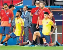  ??  ?? Sidelined: James Rodriguez stretches on the touchline while his team-mates train yesterday