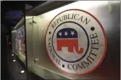  ?? RAINIER EHRHARDT — THE ASSOCIATED PRESS FILE ?? The Republican National Committee logo is shown on the stage as crew members work at the North Charleston Coliseum in North Charleston, S.C., on Jan. 13, 2016,