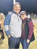  ?? [PHOTO PROVIDED] ?? Cashion assistant coach Cale Cochran, left, with his wife, Jacie, after a Cashion football game. Jacie died during childbirth on July 2.