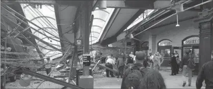  ?? COURTESY IAN SAMUEL, THE ASSOCIATED PRESS ?? Hoboken Terminal, which was the last stop on the run, was a mass of downed wires and collapsed roof sections. One person was killed.