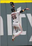  ?? Associated Press ?? Giants center fielder Gorkys Hernandez makes a running catch in the sixth inning on Monday.