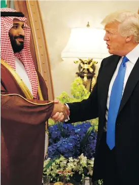  ?? EVAN VUCCI / THE ASSOCIATED PRESS FILES ?? U.S. President Donald Trump greets Saudi Crown Prince Mohammed bin Salman last year. Trump has touted the Saudis as an important ally in opposing Iran and fighting extremism, and a lucrative trading partner.