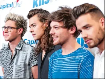  ?? PHOTO BY RICH FURY, INVISION/AP, FILE ?? From left, Niall Horan, Harry Styles, Louis Tomlinson and Liam Payne, formerly the band One Direction.