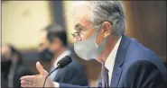  ?? CAROLINE BREHMAN/POOL VIA AP ?? Federal Reserve Chair Jerome Powell testifies during a House Financial Services Committee hearing about the government’s emergency aid to the economy in response to the coronaviru­s on Capitol Hill in Washington on Tuesday.