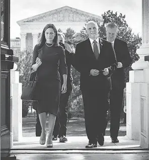  ?? ERIN SCHAFF/ AP ?? Judge Amy Coney Barrett, nominee to the Supreme Court, and Vice President Mike Pence arrive at the Capitol on Sept. 29.