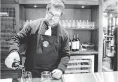  ?? STEPHEN BRASHEAR FOR USA TODAY ?? Casey O’Neill serves wine at a Starbucks in Seattle. Sales of alcohol attract customers at night, when business often slows.