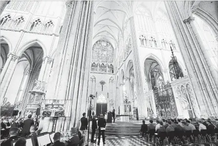  ?? BENOIT TESSIER THE ASSOCIATED PRESS ?? Prince William, centre, speaks at the Cathedral of Amiens in France on Wednesday, during a ceremony to mark the 100th anniversar­y of the First World War Battle of Amiens. The battle is said to have convinced the Germans that the war was unwinnable.