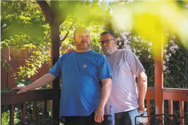  ?? Sarahbeth Maney / Special to The Chronicle ?? Chad Baker (left), an emergency room nurse at Kaiser Richmond, and husband Tom Baker, who has respirator­y problems and an immune system disorder, had to separate for 14 months as a health safeguard.