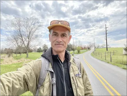  ?? COURTESY OF NEIL KING ?? Journalist Neil King on his walk from Washington, D.C., to New York. The selfie was taken in Frysville, Lancaster County. He walked through Chester County on April 8.