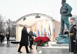  ?? SERGEY GUNEEV Kremlin Pool Photo via AP ?? Cuba’s President Miguel Díaz-Canel Bermudez, left, and Russian President Vladimir Putin take part in the unveiling ceremony of a monument to the late Cuban leader Fidel Castro, right, in Moscow, Russia, on Nov. 22, 2022.