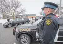  ?? FRANK GUNN THE CANADIAN PRESS ?? OPP Sgt. Tom Valtonen salutes as the hearse carrying OPP Const. Marc Hovingh leaves Toronto on its way to Manitoulin Island on Monday.