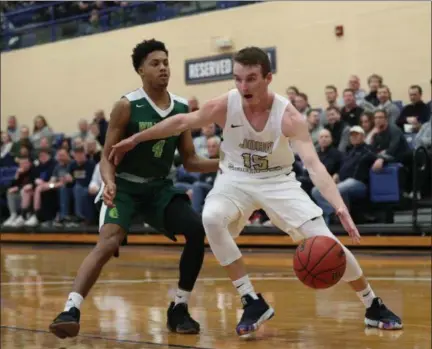  ?? TIM PHILLIS — FOR THE NEWS-HERALD ?? John Carroll’s Jackson Sartain works against Wilmington’s Kevin Lewis on Feb. 16 at John Carroll.