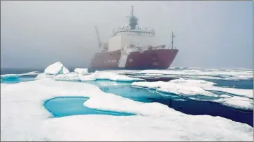  ?? BONNIE JO MOUNT / WASHINGTON POST ?? Ice floes and fog surround the U.S. Coast Guard Cutter Healy in the Arctic Ocean in July. The cutter is the largest icebreaker in the Coast Guard and serves as a platform for scientific research.