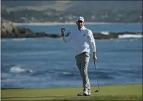  ??  ?? Nick Taylor, of Canada, reacts on the 18th green of the Pebble Beach Golf Links after winning the AT&T Pebble Beach National Pro-Am golf tournament Sunday.