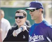  ?? Luis Sinco Los Angeles Times ?? ANDREW FRIEDMAN, Dodgers’ president of baseball operations, and Don Mattingly laugh together.