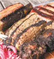  ?? Horn Barbecue ?? Horn Barbecue features smoked brisket, ribs and housemade sausage, among many other offerings.