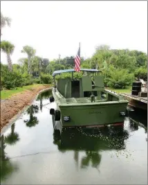  ??  ?? A mock-up of the Mekong Delta naval support base features a shallow-bottom “brown water” patrol boat.