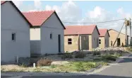  ?? PICTURES: SISONKE MLAMLA ?? DELAYED: Unfinished RDP houses in Delft have become a haven for criminals.