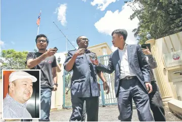  ??  ?? Journalist­s trying to obtain some informatio­n from a Royal Malaysian Police officer who had earlier entered the premise of the North Korean embassy at Jalan Batai, Pusat Bandar Damansara. (Inset) Kim Jong-Nam. — Bernama photo