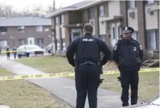  ?? NICOLAUS CZARNECKI / HERALD STAFF FILE ?? DISPUTED TERRITORY: Police remain at the scene of an overnight double shooting at the Pelham Apartments Complex in Framingham.