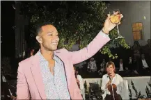  ?? PHOTO BY JEROD HARRIS/GETTY IMAGES FOR AIRBNB ?? John Legend performs onstage at the launch of his new rose wine brand, LVE, during an intimate Airbnb Concert on June 21 in Beverly Hills, Calif. By Sheila Marikar