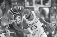  ?? STEPHEN SYLVANIE / USA TODAY SPORTS ?? LeBron James of the LA Lakers drives past Golden State Warriors’ Kevin Durant during a preseason game last week.