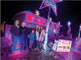  ?? Herald photo by Ian Martens ?? The Groves family, Scott and Nancy and their children Caleb, Trinity, Jordana and Jessalin, are once again lighting up their yard for the holiday season. @IMartensHe­rald