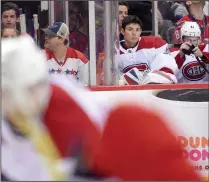  ?? CP/AP PHOTO NICK WASS ?? Montreal Canadiens goalie Carey Price, second from right, sits on the bench during the second period of a game against the Washington Capitals, Saturday, Oct. 7, in Washington. Price said he is staying off the ice for a little while longer as he deals...