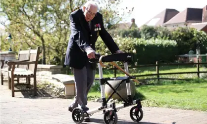  ??  ?? Captain Tom Moore, a 99-year-old second world war veteran, has raised money for NHS Charities Together by walking lengths of his garden. Photograph: Peter Cziborra/Reuters