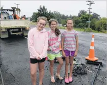  ?? PHOTOS: LINDA ROBERTSON/CRAIG BAXTER ?? Eyes in the sky . . . Top: Wingatui youngsters (from left) Samantha Gaston, Crystal Darling and Maleena Taia (all 12), who are all year 8 pupils at Taieri College, helped alert the authoritie­s yesterday after a water main (at their feet) burst near the...