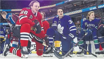  ?? DAVE SANDFORD GETTY IMAGES ?? All-stars Patrick Kane and Auston Matthews injected some fun into their Sunday showdown with their goal celebratio­ns.