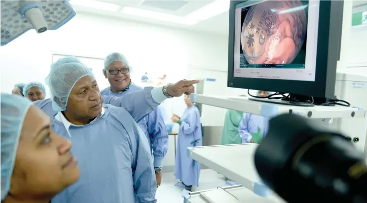  ?? Photo: Jone Luvenitoga ?? Prime Minister Voreqe Bainimaram­a during his tour of the new gastroente­rology surgical lab opening on July 17, 2017 at the Colonial War Memorial Hospital in Suva. Behind him is Dr Jo Malani.