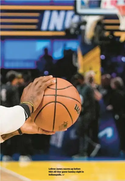  ?? AP ?? LeBron James warms up before NBA All-Star game Sunday night in Indianapol­is.