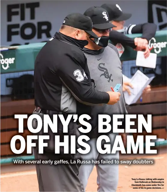  ?? AP ?? Tony La Russa, talking with umpire Sam Holbrook on Wednesday in Cincinnati, has come under fire for some of his in-game decisions.