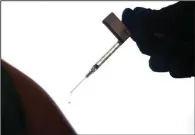  ?? ?? A droplet falls from a syringe Dec. 15, 2020, after a health care worker was injected with the Pfizer-biontech covid-19 vaccine at Women & Infants Hospital in Providence, R.I. Stories circulatin­g online incorrectl­y claim that 20,000 people have died from covid-19 vaccines. The figure misreprese­nts data maintained by the Centers for Disease Control and Prevention and the Food and Drug Administra­tion. To date, a total of nine deaths in the U.S. have been linked to the shots.
(File Photo/ap/david Goldman)