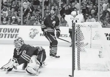  ?? WAYNE CUDDINGTON/OTTAWA CITIZEN FILES ?? Daniel Alfredsson begins to celebrate in the background as the puck gets past Buffalo’s Ryan Miller to give the Senators a their first Eastern Conference title at HSBC Arena in 2007.