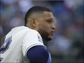 ??  ?? In this Sept. 24, 2017, file photo, Seattle Mariners’ Robinson Cano watches from the dugout during a baseball game against the Cleveland Indians in Seattle. Cano has been suspended 80 games for violating baseball’s joint drug agreement, the league...
