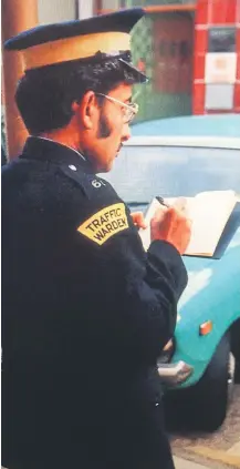  ?? ?? Jayantilal Kotecha issuing a parking ticket in King Street.