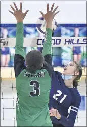  ??  ?? Chino Hills’ Malena Thé, right, has her shot blocked by Upland’s Erin McNeill during Tuesday night’s match.