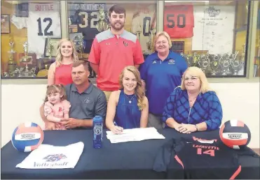  ??  ?? Recent LaFayette High School graduate Emily Redden (seated, center) signed a letter of intent last Monday to play volleyball for Chattanoog­a State. Also on hand for the ceremony was (from left) Alyssa, Tim and Sonya Redden. On the back row was former LaFayette assistant coach Caitlyn Burdette, LaFayette head coach Chris Logan and Chattanoog­a State head coach Janet Tate. (Photo by Scott Herpst)