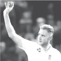  ??  ?? Stuart Broad celebrates the wicket of Shane Dowrich (Reuters/Paul Childs)