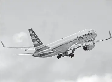  ?? [AP FILE PHOTO] ?? An American Airlines passenger jet takes off from Miami Internatio­nal Airport. American and United have started selling cheaper “basic economy” fares.
