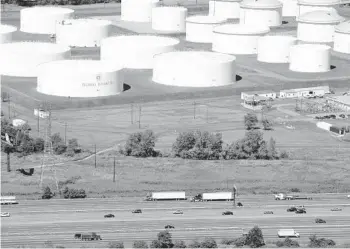  ?? MARK LENNIHAN/AP 2008 ?? Oil storage tanks owned by Colonial Pipeline. The company’s pipelines run from New Jersey to Texas.