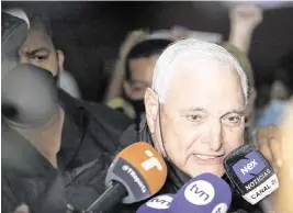  ?? BIENVENIDO VELASCO Sipa USA/EFE ?? The former president of Panama, Ricardo Martinelli, speaks to reporters in November 2021. Martinelli had appeared in polls as the front-runner for Panama’s May 5 presidenti­al election but was disqualifi­ed from running after he received a 10-year sentence for money laundering.