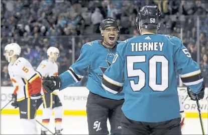  ?? PHOTOS BY MARCIO JOSE SANCHEZ — THE ASSOCIATED PRESS ?? The Sharks’ Evander Kane, center, celebrates his second-period goal with Chris Tierney during Saturday’s 5-1home victory over Calgary.