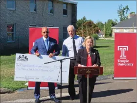  ?? DAN SOKIL - MEDIANEWS GROUP ?? State Senators Vincent Hughes, holding check, and Maria Collett, at podium, and Upper Dublin Township Manager Kurt Ferguson speak about new grant funding secured for those harmed by Hurricane Ida and a related tornado in 2021.