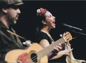  ?? Maria Alejandra Cardona Los Angeles Times ?? SINGER Leah Rose Gallegos is co-founder of East L.A.’s People’s Yoga, which is expanding to Boyle Heights.