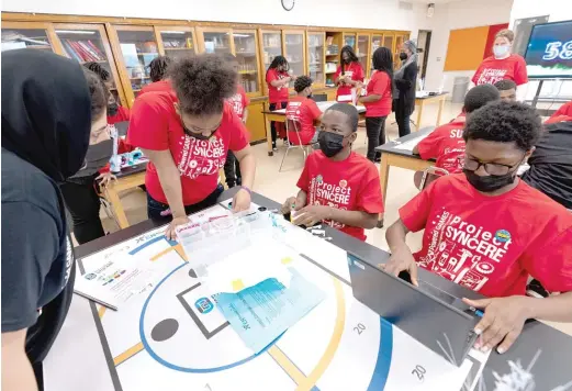  ?? PROVIDED PHOTO ?? Charles Sumner Math & Science Community Academy students participat­e in the ENpowered Games robot challenge on Thursday. The team placed first in the class competitio­n.