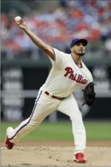 ?? MATT SLOCUM — THE ASSOCIATED PRESS ?? Pitcher Zach Eflin played the role of stopper as he tossed six solid innings to help the Phillies snap a four-game losing streak with a 4-3 victory over the Milwaukee Brewers Sunday at Citizens Bank Park.