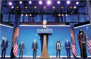  ?? REUTERS ?? President-elect Joe Biden stands with his nominees for his national security team at his transition headquarte­rs in the Queen Theater in Wilmington, Del. on Tuesday.